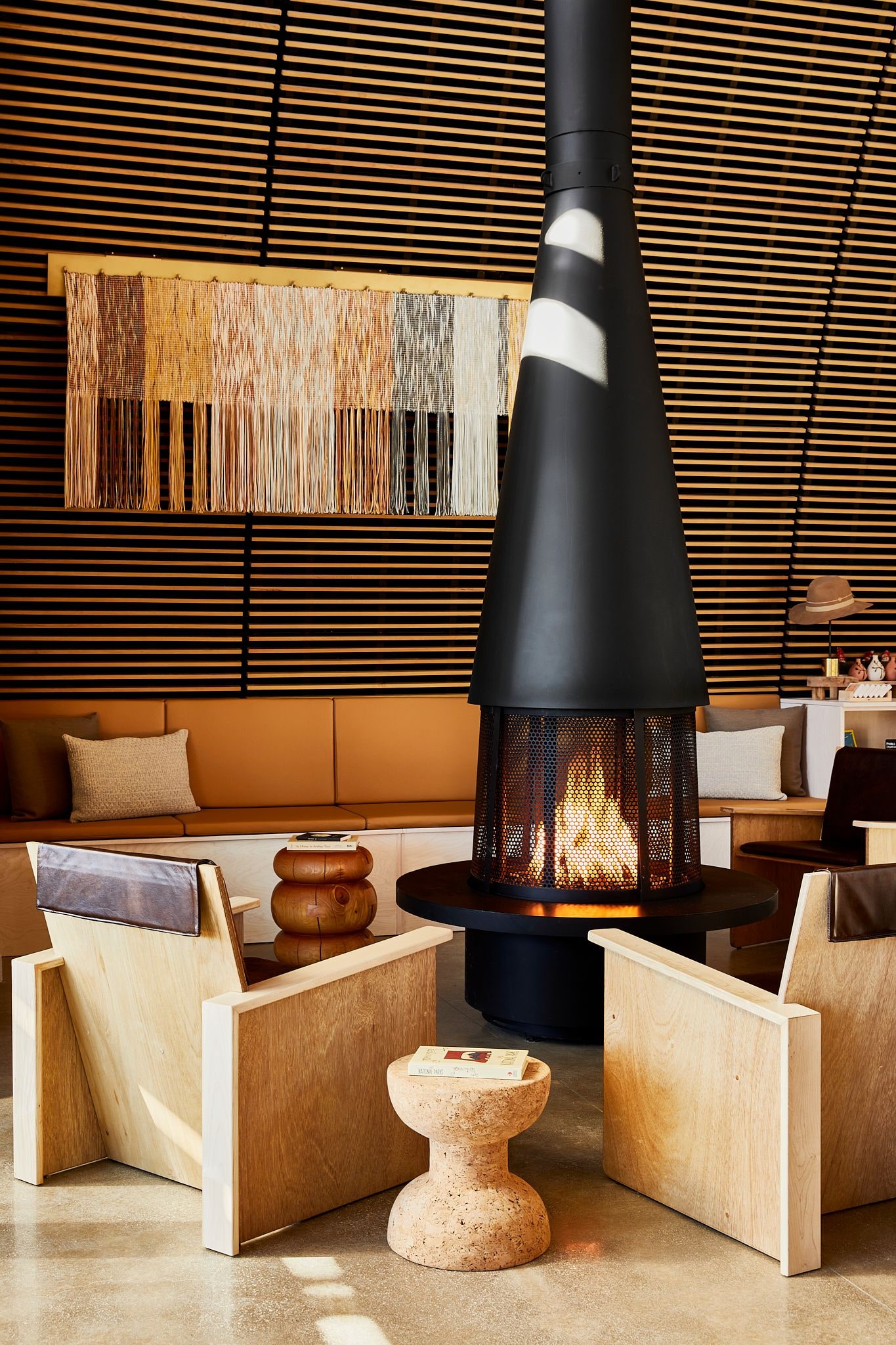 Images may contain interior design lights clothing hats home decoration architecture foyer and accessories